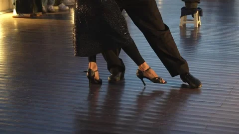 Professional couple dancing argentine tango steps on wooden floor Stock Footage 339555886