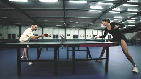 Professional couple playing an intense table tennis match Stock Footage 327066159