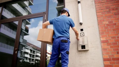 Professional Courier Making Secure Deliveries with Advanced Intercom System Stock Footage 279800710
