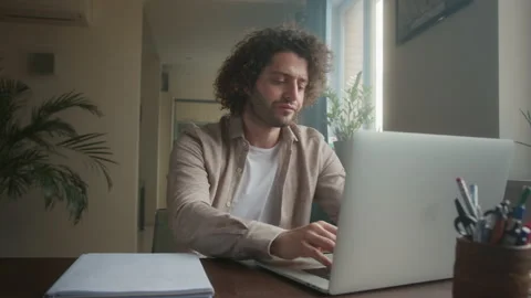 Professional Creative Man Sitting at His Desk in Home Office Studio Working on a Stock Footage 190566351
