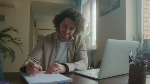 Professional Creative Man Sitting at His Desk in Home Office Studio Working on a Stock Footage 192050352