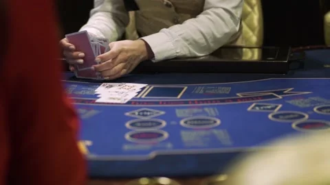 Professional croupier shuffling cards on table in casino, poker game. Close-up Video stock 132063584