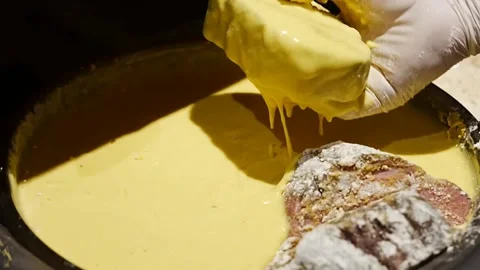 Professional culinary preparation of roasted meat coated in panko breadcrumbs Stock Footage 345930358