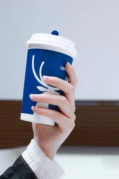 Professional with a cup of coffee in hand Stock Photos