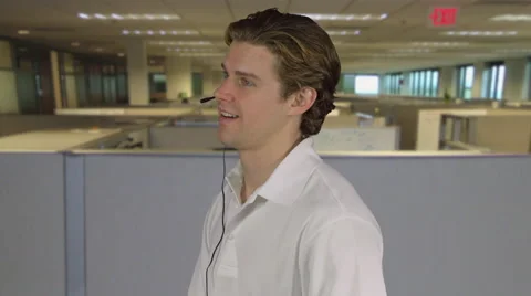 Professional customer rep man answers call in call center Stock Footage 64862497
