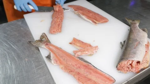 Professional cutting of raw red salmon fish. Stock Footage 118976335