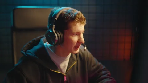 Professional cyber gamer play computer game live stream. Man streamer headset. Stock Footage 328221229