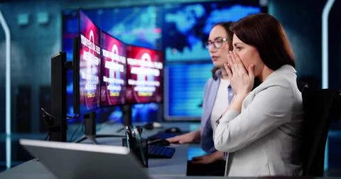 Professional cybersecurity analyst preventing ransomware cyber attack Stock Photos