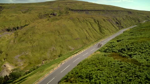 Professional cyclists racing on a mountain road Stock Footage 336804592