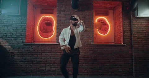 Professional dancer with a black hat moving amazing on the front of the camera Video stock 84552061