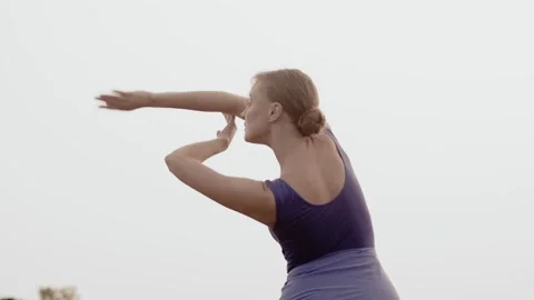 Professional dancer gracefully dances with hands, outdoor. White ballerina Video stock 205036558