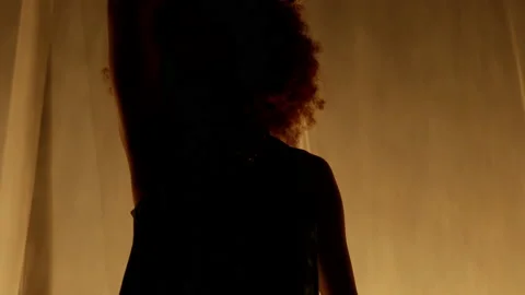 Professional Dancer Performing Against Stage Curtain with Warm Backlit Video stock 207835725