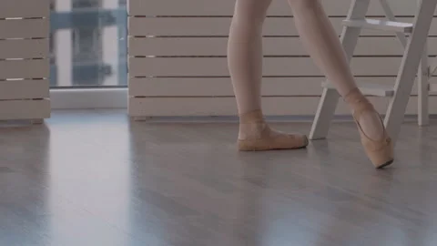 Professional dancer on pointe doing rotation on a diagonal. close-up shot in Stock Footage 96539783