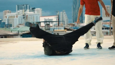 Professional dancer practice B boy dance with friends at roof top. hiphop. Stock Footage 263334479