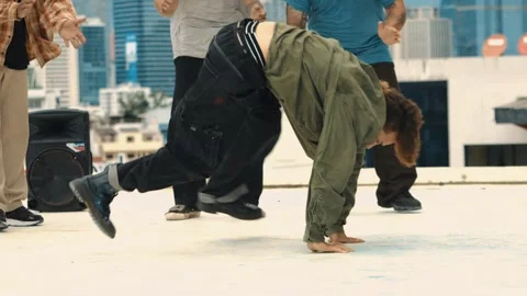 Professional dancer practice B boy dance with friends at roof top. hiphop. Stock Footage 263485664