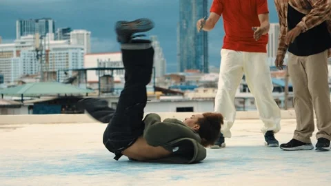 Professional dancer practice B boy dance with friends at roof top. hiphop. Stock Footage 263679079