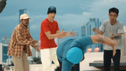 Professional dancer practice B boy dance with friends at roof top. hiphop. Stock Footage 264090210