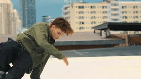 Professional dancer practice B boy dance with friends at roof top. hiphop. Stock Footage 266454286