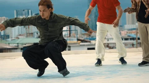 Professional dancer practice B boy dance with friends at roof top. hiphop. Stock Footage 266845890