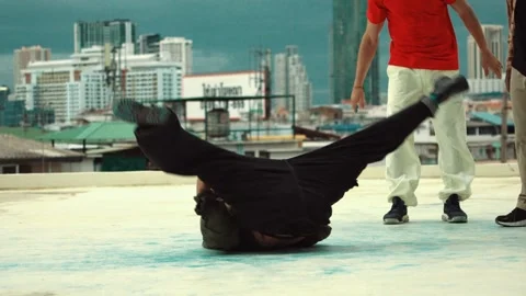 Professional dancer practice B boy dance with friends at roof top. hiphop. Stock Footage 272739246