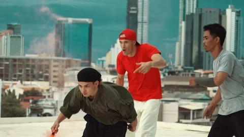 Professional dancer practice B boy dance with friends at roof top. hiphop. Stock Footage 273015661