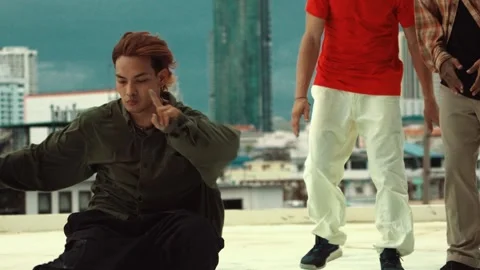 Professional dancer practice B boy dance with friends at roof top. hiphop. Stock Footage 275568855