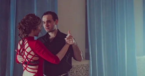 Professional dancers are dancing tango in the smoky studio Stock Footage 87767259