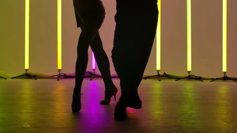 Professional dancers dance rumba in the studio against the backdrop of bright Stock Footage 146086973