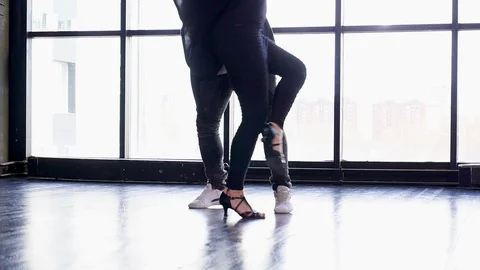 Professional dancers dancing in the studio. Legs of professional dancers. Stock Footage 88777304