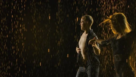 Professional dancers perform salsa elements in a dark smoky studio. Silhouettes Stock Footage 143743503
