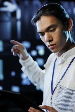 Professional in data center with tablet Stock Photos