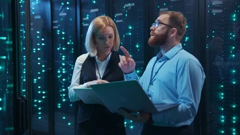 Professional data center team cooperating at computer security. Bearded IT Stock Footage 120794498