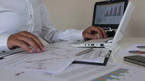 Professional Data Review at a Busy Office Workspace Stock Footage 346182465