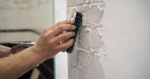 Professional decorator in the process of creating of brick wall style. Stock Footage 88565035