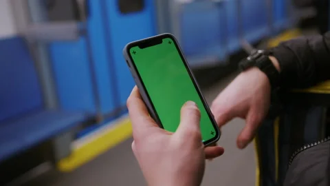 Professional delivery. Close-up of a man's hands with a mobile phone. Subway car Stock Footage 236088799