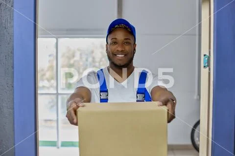 Professional delivery service employee of man qualitatively performs ...