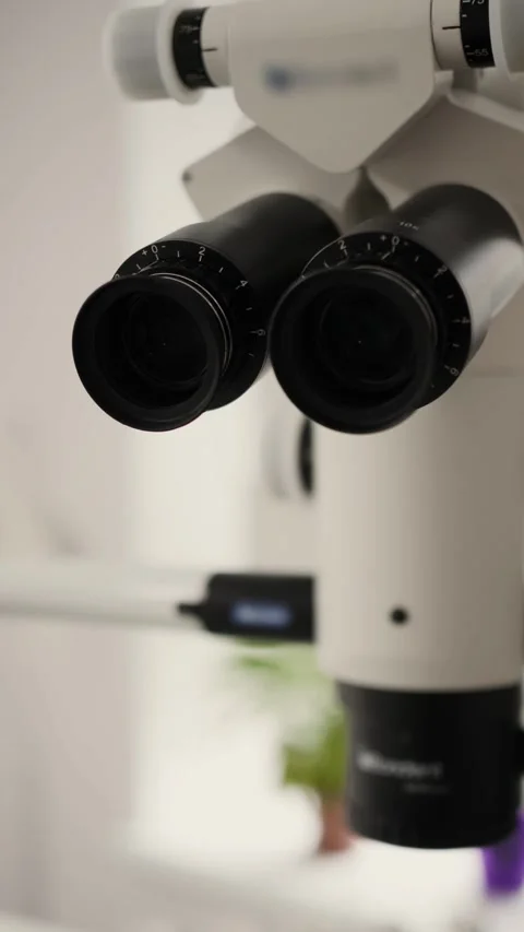 Professional Dental Microscope in Modern Clinic Vertical Video Stock Footage 338406455