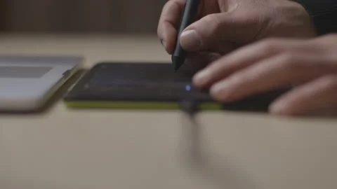 Professional designer is drawing on computer, with a black tablet. Close-up shot Stock Footage 146099888