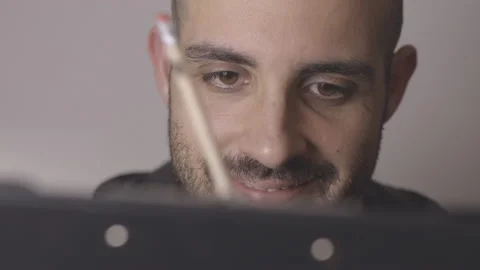 Professional designer thinks, then has an idea for a sketch. Closeup shot Video stock 145127930