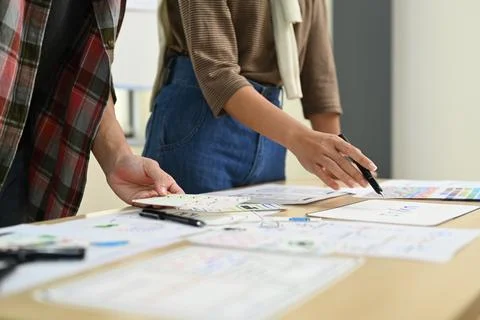 Professional developer team discussing about mobile app interface wireframe Stock Photos