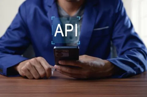 Professional Developer Using Smartphone to Access API Interface Stock Photos