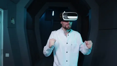 Professional developer wearing a headset in futuristic interior Stock Footage 236537038