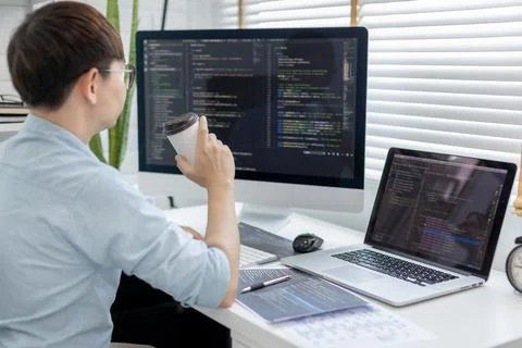 Professional development programmers are sipping coffee in a private office, Foto stock