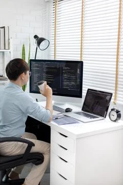 Professional development programmers are sipping coffee in a private office, 스톡 사진