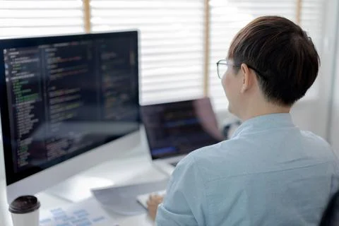 Professional development programmers are sit on a desk with work equipment su 스톡 사진