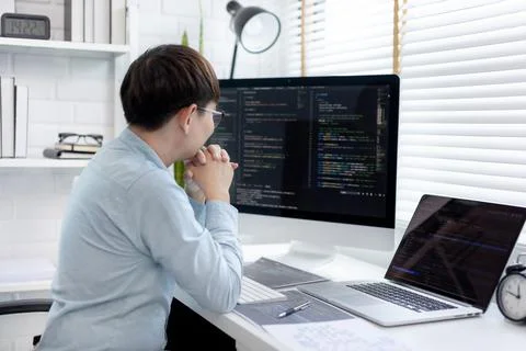 Professional development programmers are sit on a desk with work equipment su 스톡 사진