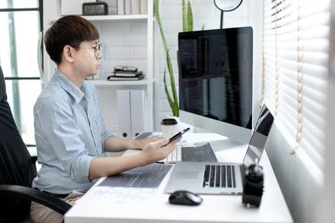 Professional development programmers are using mobile phones to test the func 스톡 사진