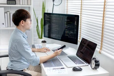 Professional development programmers are using mobile phones to test the func 스톡 사진