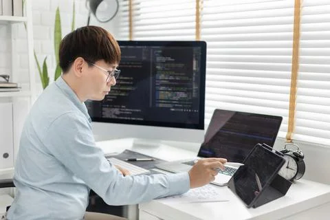 Professional development programmers are using tablet to test the functionali 스톡 사진