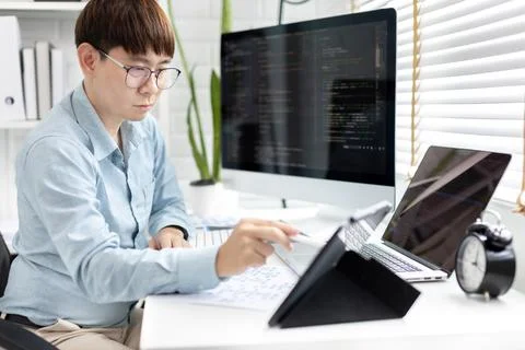 Professional development programmers are using tablet to test the functionali Stock Photos